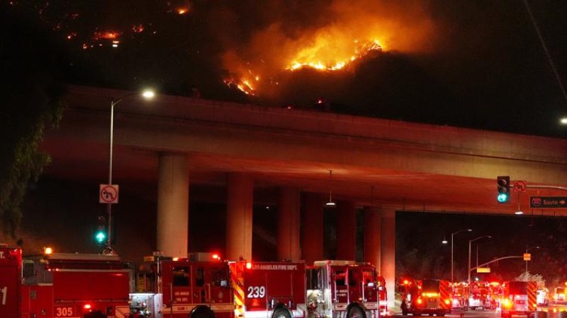 Firefighters battle huge blaze near Los Angeles as winds pick up