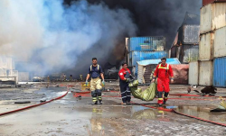Iran arrests two over port blast, including senior government employee