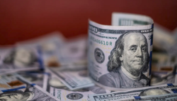 Dollar holds below 3-week peak following inflation data