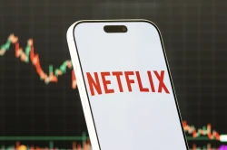 Netflix gets bigger. Wall Street wants more